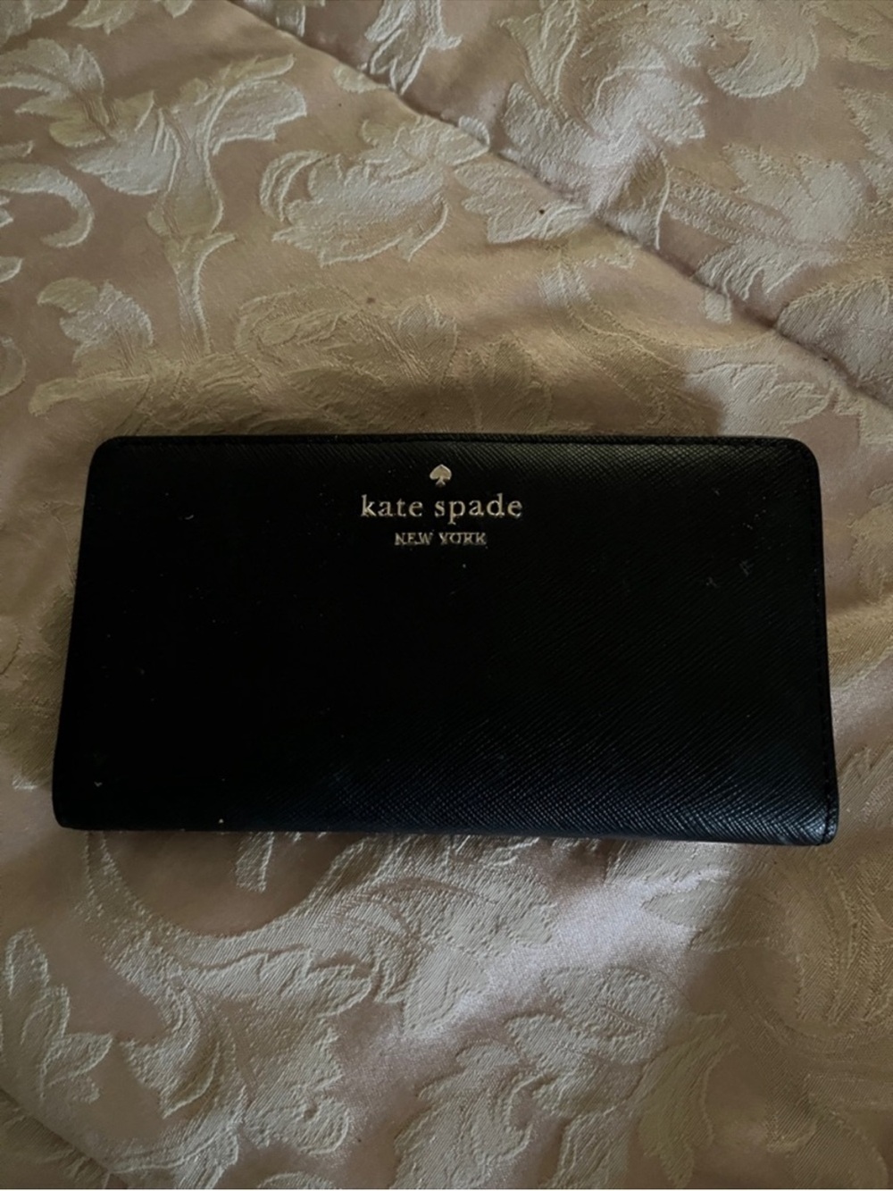 kate spade black zip-around saffiano wallet with gold logo